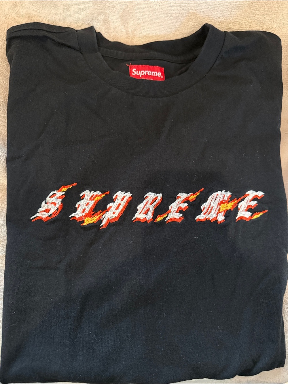 Supreme Black Tee with White and Orange Flame Script